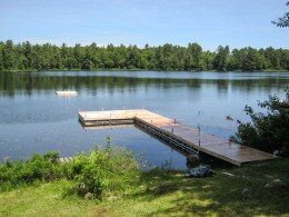 An L-shaped Pipe Dock with a Swim Raft.